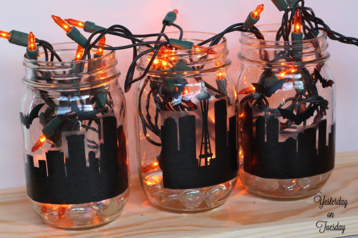 Spooky City Mason Jar Decor: How to transform plain mason jars into a spooky city scene for Halloween.