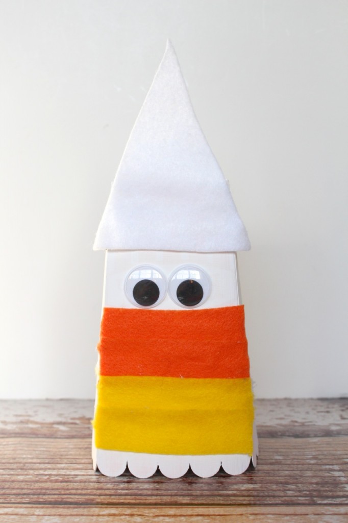 Transform a popcorn box into a candy corn gift plus enter this giveaway to win prizes from your favorite craft companies