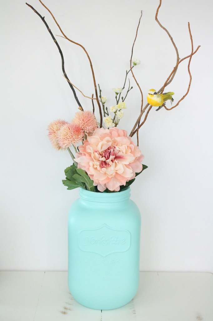 A giant spray painted mason jar makes a striking spring vase