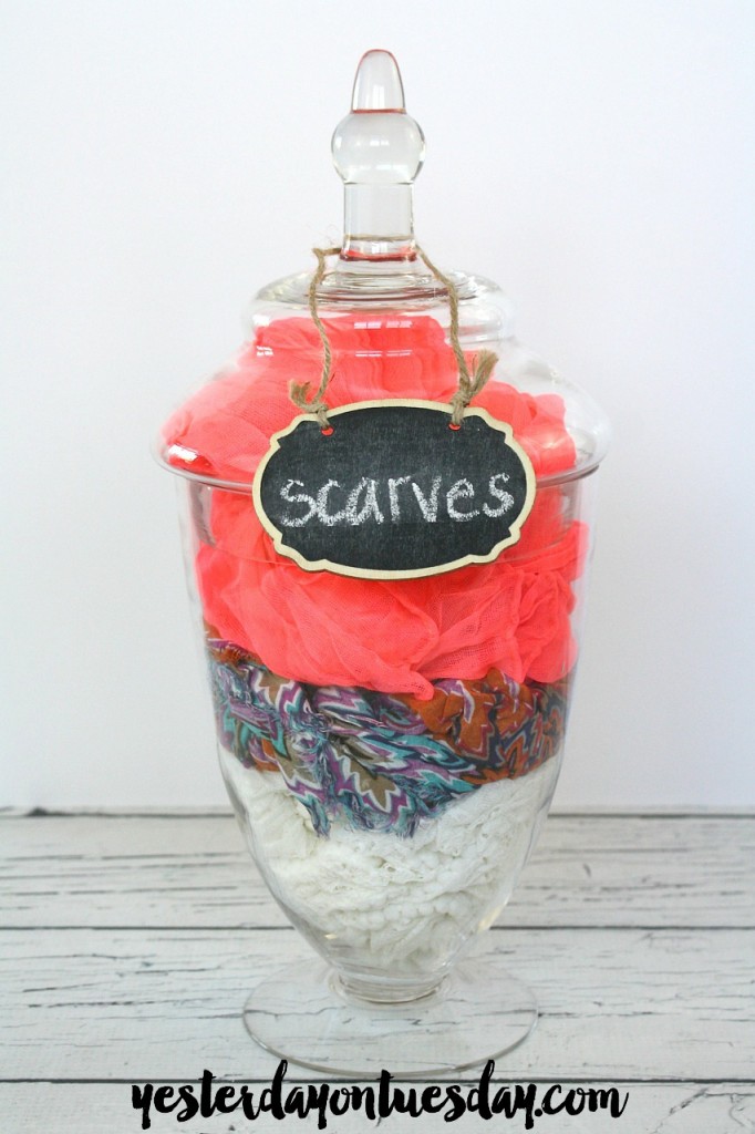 Stow scarves in a apothecary jar for easy access