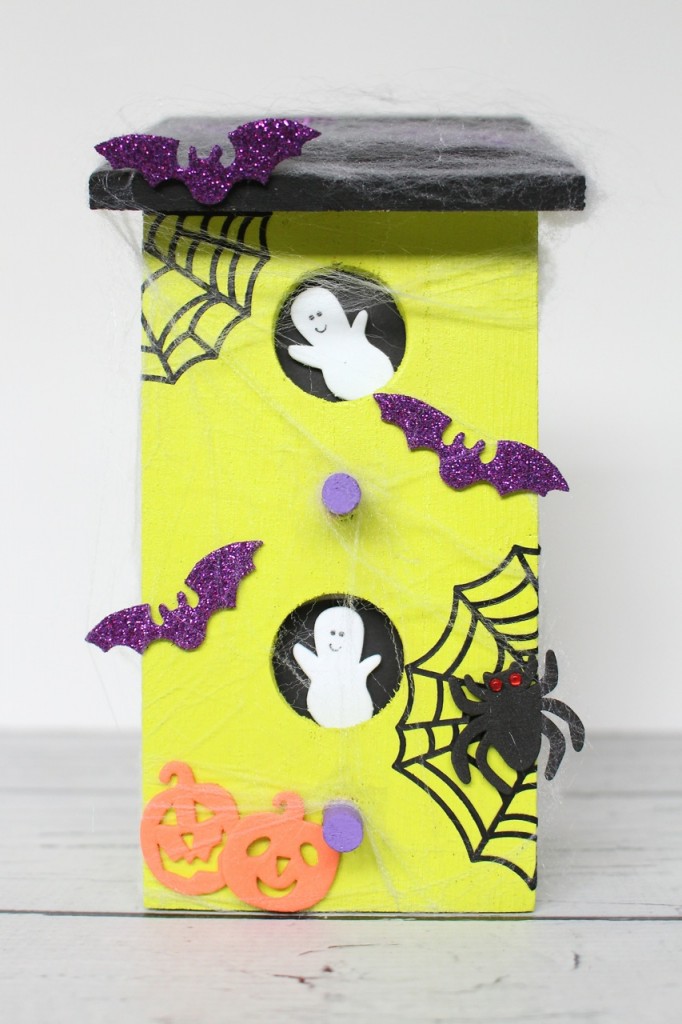 7 Spooky Halloween Kids Crafts including a Spider Web Doily Dream Catcher, Pom-Pom Crows, a Pinecone Witch, Haunted House and more.
