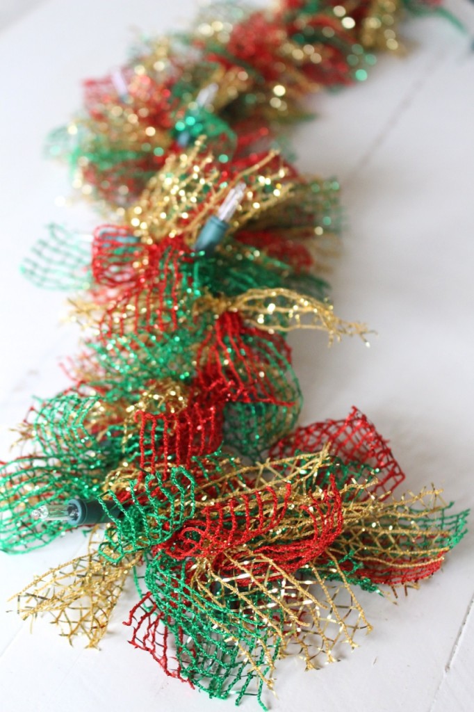 Lighted Christmas Garland: How to transform a plain string of lights and some ribbon from the dollar store into lush and festive holiday decor.