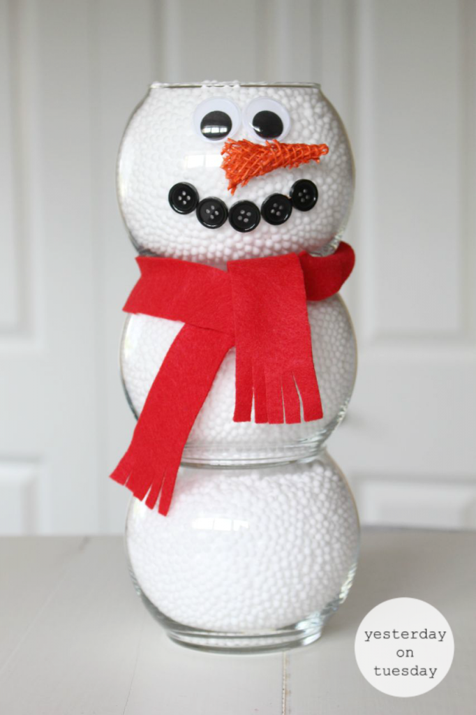 Dollar Store Fishbowl Snowman: Make a darling snowman for holiday decorating, using budget friendly supplies from the dollar store. A charming and easy way to add the spirit of the holidays to your home.